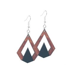 the earrings are made from wood and have black triangles on them, with silver earwires