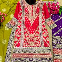 Heavy Embroidered Neon Pink Kurta Top. Dark Purple Embroidered Pants With Green Dupatta With Embroidered Purple Border And Motifs. New And Unworn Embroidered Purple Sharara, Purple Floral Embroidered Sharara For Eid, Purple Floral Embroidery Sharara For Eid, Purple Long Sleeve Sharara With Intricate Embroidery, Festive Purple Embroidered Fabric With Dabka Work, Purple Embroidered Fabric For Eid, Bollywood Style Purple Salwar Kameez With Floral Embroidery, Green Dupatta, Purple Border