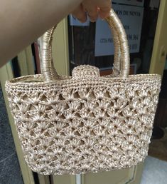 "Welcome! A beautiful vintage beige raffia handbag In good vintage condition! Measures: W: 9.24\" (24 cm) H with handles: 9.24\" (24 cm) Deep: 3.5\" (8 cm) Thanks for stopping by!!IMPORTANT: Due to the delicate situation We're all going through, and in order to keep the safety of courier workers too, all orders will be dispatched when alert sanitary finished. You can purchased or reserve items like always. Thanks so much for your understanding." Handheld Woven Cream Straw Bag, Beige Straw Bag With Top Carry Handle, Beige Crochet Handheld Bag With Braided Handles, Elegant Beige Basket Straw Bag, Elegant Straw Bags With Rolled Handles, Elegant Evening Straw Bag With Double Handle, Cream Handheld Straw Bag For Daily Use, Handheld Cream Straw Bag With Handles, Elegant Crochet Straw Bag With Double Handle