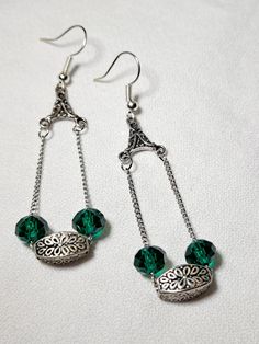 Dangle Earrings with Silver and Faceted Green beads are just shy of 2.75 inches long. These fun earrings would be great for everyday. Silver beads came from a store closing, and the faceted green beads were purchased new. Green Metal Beaded Drop Earrings, Green Crystal Earrings For Jewelry Making, Green Metal Beaded Earrings With Round Beads, Green Beaded Earrings With Round Metal Beads, Green Faceted Bead Dangle Earrings, Green Faceted Beaded Dangle Earrings, Store Closing, Dangle Earrings Silver, Green Beads