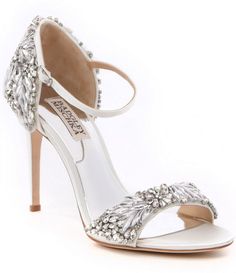 a white high heeled shoe with crystal embellishments