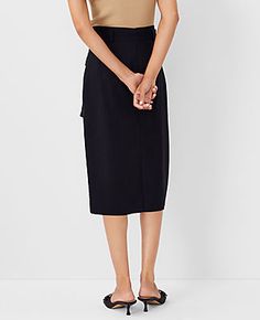 Elevate your wardrobe with the Ann Taylor Tie Waist Cargo Pencil Skirt, a blend of sophistication and practicality. This skirt is designed to cater to the modern woman's needs, featuring a sleek black color that pairs effortlessly with any top.

- **Size**: 14 (Regular)
- **Color**: Black
- **Material**: Shell: 67% Lyocell, 18% Linen, 15% Viscose; Lining: 100% Polyester
- **Gender**: Female
- **Length**: 28 inches long
- **Features**: Front flap cargo pockets, self-tie belt, belt loops, hidden b Relaxed Tie Waist Skirt For Workwear, Relaxed Skirt With Tie Waist For Work, Fall Workwear Pencil Skirt With Pockets, Black Cargo Skirt For Work, Utility Relaxed Skirt For Work, Spring Workwear Pencil Skirt With Pockets, Fall Workwear Cargo Skirt With Belt Loops, Chic Cargo Skirt With Pockets For Work, Spring Workwear Pencil Cargo Skirt