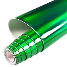 a roll of shiny green foil on white background