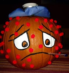 a pumpkin with an angry face painted on it