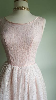 Dreamy, blush pink lace and feather-light flounce, flounce, flounce. 💖🌸This vintage party dress features a princess-seamed bodice and a nipped waist that flares to an ultra-full skirt for a flattering fit; a feminine, scooped neckline; pink satin piping trim; a soft pink lining that peeks through blush-pink lace; and a built-in tulle and crinkle cotton-gauze petticoat for fullness and elegance. Back metal zip; pictured on a US size 2/4 dress form. This gown arrives freshly cleaned and ready to Pink A-line Lace Dress, Feminine A-line Lace Dress For Wedding, Pink Lace Dress With Lace Bodice, Pink Lace Dress For Wedding, Pink Full Skirt Prom Dress, Pink Lace Patchwork Dress For Garden Party, Feminine Pink Dress For Debutante Ball, Pink Feminine Dress For Debutante Ball, Lace Dress For Garden Party