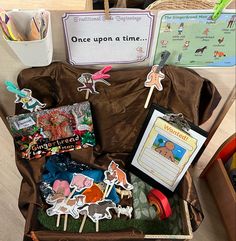 an open suitcase filled with lots of toys and paper stickers on top of it