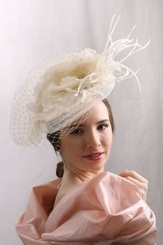 a woman in a pink dress with a white hat on her head