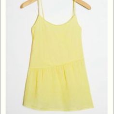 Cotton Flowy Tank By Good Luck Tee Featuring An Asymmetrical Seam Purchased From Anthropologie. Perfect For Summer Days. Size Xs. New With Tags Trendy Asymmetrical Summer Tops, Asymmetrical Tops For Spring Daywear, Yellow Asymmetrical Summer Tops, Casual Mini Length Tank Top For Summer, Casual Asymmetrical Hem Tops For Daywear, Asymmetrical Summer Tops For Day Out, Yellow Tops With Asymmetrical Hem For Spring, Spring Yellow Tops With Asymmetrical Hem, Asymmetrical Tank Top For Spring