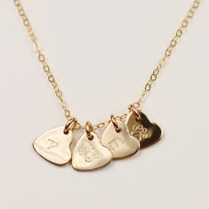 This delicate Minima heart-shaped necklace is a subtle yet bold expression of love. Minima hearts are tiny and precious, yet still make the biggest impact whenever they're worn. Wear it alone, or create your own personal necklace by stacking up with more heart charms and initials. Product Details: Material: 14k Gold Filled, Sterling silver, Rose gold filled 0.3" heart charm Production Time: Your pieces are handmade with care and love; they also take time to produce. Please allow 8- 12 business d Boyfriend Initials, Small Heart Necklace, Mama Necklace, Heart Shaped Pendant Necklace, Heart Shaped Necklace, Meaningful Jewelry, Necklace Heart, Silver Heart Necklace, Gold Initial