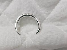 Sold By One Piece of 925 Sterling Silver 12G Septum Ring - Silver Horseshoe, Curved Barbell - Circular Bent with Balls Ends - Eyebrow Ring - Cartilage Earring * Material :- 925 Sterling Silver  * Gauge / Thickness:- 12GA (2mm)  * Diameter:- 6mm, 8mm, 10mm, 12mm, 14mm  If you have any question related to products or price and any query for this listing please contact me please select The size & Quantity You can Directly Visit our shop Here:- https://silverjewellershub.etsy.com We strive to bring Septum Tusk, Eyebrow Ring, Nose Ring Stud, Cartilage Earrings, Body Jewellery, Septum Ring, Eyebrows, Body Jewelry, Amazing Jewelry