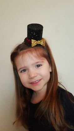 "Mini Ringmaster hat measures approx 3 1/2\" tall and approx 3\" diameter Perfect touch to the adorable romper shown here made by the shop everafterfairytales..romper not included in this listing... Elastic headband sized to fit adult or child..please leave a note at checkout regarding age of Child Made from our non shedding super sparkly glitter material" Adjustable Costume Hats For Themed Events, Novelty Costume Hat With Adjustable High Crown, Novelty Adjustable High Crown Costume Hat, Fun Adjustable Costume Accessories For Birthday, Fun Adjustable Costume Hats For Themed Events, Novelty Mini Cap Hats For Party, Themed Party Hat For Carnival, Fun Adjustable Costume Hats And Headpieces For Themed Events, Adjustable Christmas Costume Party Accessories