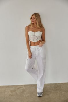 Get ready for a weekend getaway in the Vienna Linen Cargo Pants! These wide leg pants feature double front pockets, two cargo-style leg pockets, and an elastic waistband with an adjustable drawstring. Available in white and linen. Pair with the Mae Lace Crop Top to complete the look! Details 55% Linen, 45% Viscose High rise Dry clean only Linen Cargo Pants, American Threads, Get Ready For Summer, Cargo Style, Ruffled Maxi Dress, Lace Crop Tops, Lace Ruffle, Sweater Sale, Weekend Getaway