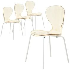 four white chairs sitting next to each other