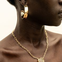 A fresh take on gold hoops: bold, yet sleek. The Maji Hoops are grounding and will have you feeling your most confident. With a handcrafted hammered effect, these earrings were responsibly made by our artisan partners in Kenya using traditional techniques in 24K gold-plated brass. Dimensions: Internal Diameter: 1.65in (42mm)Width of the hoop: 0.39in (10mm) Yellow Gold Hammered Metal Hoop Earrings, Gold Hammered Small Hoop Jewelry, Small Hoop Hammered Gold Jewelry, Small Hammered Gold Hoop Jewelry, Minimalist Polished Brass Hoop Earrings, Hammered Gold-plated Hoop Earrings, Hammered Gold Plated Hoop Earrings, Modern Hammered Drop Hoop Earrings, Minimalist Hammered Metal Hoop Earrings