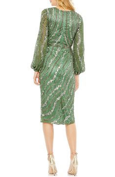 Swirls of sequins animate this elegant cocktail dress, rendered in a verdant hue and styled with a gracefully draped bodice. Surplice V-neck Long sleeves Lined, except sleeves 100% polyester Spot clean Imported Asian Owned/Founded Mesh Cocktail Dress, Vestidos Color Coral, Cocktail Dresses With Sleeves, Dress Sparkle, Tea Length Skirt, Intricate Beading, Elegant Cocktail Dress, Radiate Confidence, Unique Prom Dresses