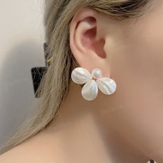 Dainty white flower pearl stud earrings, this pearl earring can be used as a reward for yourself or as a gift for a friend. Perfect gifts for happy birthday, New Year, Valentine's Day, Mother's Day, Thanksgiving Day, Chrism. ✨Product Details 𖧹 Base Metal: Sterling Silver (S925) 𖧹 Pearl Size: 10mm 𖧹 Gemstone: Mother Of Pearl 𖧹 Two studios (New York and Florida): Handcrafted in NY Studio  ✨Our jewelry is packaged in an ornament box or envelope. To avoid waste, usually more than one item will b Pearl White Flower Earrings For Pierced Ears, Pearl White Flower Earrings, White Pearl Flower Earrings For Formal Occasion, White Pearl Earrings In Flower Shape For Formal Events, White Flower-shaped Pearl Earrings For Formal Events, White Floral Pearl Earrings For Formal Occasions, White Floral Pearl Earrings For Formal Events, Formal White Flower-shaped Pearl Earrings, Flower Shaped Pearl Earrings With Pearl Drop