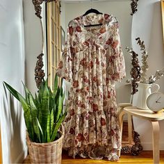 Size: Xs Condition: Excellent - Never Worn Floral V-Neck Tiered High/Low Sheer Maxi Dress. Lined. Material: Polyester Measurements: 54” Shoulder To Hem 18” Pit To Pit Beige Floral Print Maxi Dress For Casual Wear, Cream Bohemian Maxi Dress For Casual Wear, Bohemian Cream Maxi Dress For Fall, Beige Floral Print V-neck Midi Dress, Beige V-neck Floral Dress For Brunch, White Bohemian V-neck Floral Dress, Cream Floral Print V-neck Midi Dress, Cream Boho Print Dresses For Spring, Beige Boho Print Chic Dress