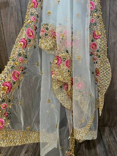 Gorgeous net dupatta with floral embroidered border and sequins work. Light Sky Blue Embroidered Semi-stitched Lehenga For Summer, Spring Festive Multicolor Dupatta, Festive Choli With Multicolor Embroidery And Sheer Dupatta, Festive Multicolor Embroidered Choli With Sheer Dupatta, Festive Floral Embroidery Lehenga In Net, Summer Semi-stitched Choli With Dupatta, Festive Net Lehenga With Floral Embroidery, Semi-stitched Bollywood Saree For Spring, Summer Festive Embroidered Lehenga