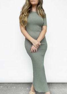 Subtle yet bold - this short sleeve fitted knit midi dress is a staple for the spring season. Featuring a high boat neck, stretch ribbed knit, and 1/4 sleeves. Can be dressed up or down with either sneakers and a denim jacket, or heels and a leather jacket! Model is 5'3" and wears the size 4. Materials: 65% viscose, 35% nylon. Designed in Australia. *SALE ITEMS ARE FINAL SALE & CANNOT BE RETURNED* Return Policy Spring Ribbed Midi Dress, Trendy Stretch Sweater Dress Midi Length, Summer Ribbed Stretch Sweater Dress, Ribbed Knee-length Midi Dress, Summer Stretch Ribbed Sweater Dress, Stretch Ribbed Sweater Dress For Summer, Spring Knit Sweater Dress With Ribbed Neckline, Fitted Midi Sweater Dress For Spring, Spring Ribbed Bodycon Sweater Dress