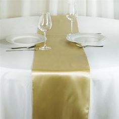 the table is set with two empty wine glasses