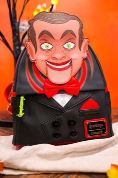 Goosebumps Slappy Cosplay Mini Backpack - Whiskey Skies Halloween Themed Travel Backpack, Themed Halloween Travel Backpack, Themed Backpack For Cosplay, Novelty Halloween School Backpack, Goosebumps Slappy, Backpack Accessories, Zipper Charms, Over The Top, Red Bow