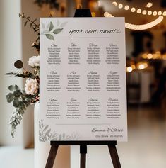 a table plan sitting on top of a wooden easel