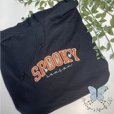 Our Spooky Season Embroidered Hoodie is the perfect way to embrace the Halloween season in style. Its playful design, high-quality applique and embroidery, and comfortable fabric make it a cozy addition to your fall wardrobe. Ready to make a statement this October? Get your hands on our one-of-a-kind hoodie now and show the world you mean business! Trendy Embroidered Hooded Sweatshirt, Trendy Embroidered Hooded Hoodie, School Spirit Hooded Hoodie For Fall, Fall School Spirit Hooded Hoodie, Cotton Hooded Sweatshirt For School Spirit, Spooky Cotton Hoodie For Streetwear, Trendy Cotton Halloween Hoodie, Trendy Hooded Sweatshirt With Letter Embroidery, Embroidered Hoodie For Fall Streetwear