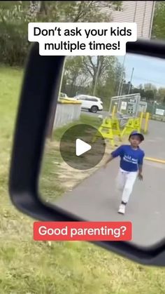 a little boy is walking down the street in front of a mirror with an ad on it