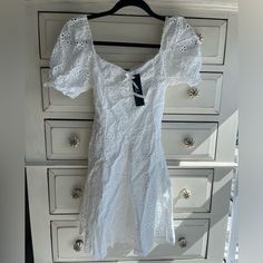 White Eyelet Dress With Bow Detail In The Front Bow Tie Dress, White Eyelet Dress, Lulus Dresses, Dress With Sleeves, Bow Dress, Eyelet Dress, White Eyelet, Lulu Dresses, Tie Dress