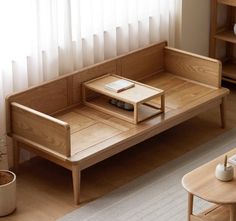 a living room with a wooden couch and coffee table