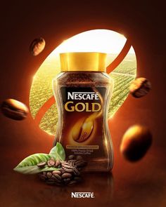 an advertisement for nest cafe gold with coffee beans and leaves in the foreground, on a brown background