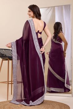 Elegance meets tradition in this stunning Art Silk saree, perfect for the festive season. The rich fabric drapes beautifully, enhancing your silhouette with every step. Intricate border work adds a touch of glamour and sophistication, making it a timeless addition to your ethnic wardrobe. Whether you're attending a wedding or celebrating a festival, this saree is sure to make you stand out in style. Eid Puja Pre-draped Saree With Embroidered Border, Navratri Pre-draped Saree With Border, Bollywood Style Pre-draped Saree With Border For Eid, Festive Semi-stitched Pre-draped Saree For Puja, Dola Silk Pre-draped Saree With Embroidered Border For Puja, Party Wear Pre-draped Chanderi Saree With Embroidered Border, Traditional Pre-draped Saree With Border, Bollywood Style Floor-length Saree With Pallu, Pre-draped Saree With Cutdana For Eid