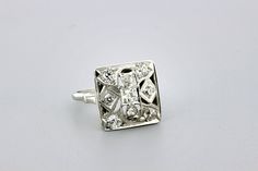 This fantastic ring is made in brilliant 14K white gold with dazzling pave set diamonds. This Mosaic square styled cocktail ring is set with 0.75ct total weight in white diamonds. The head of the ring is 16.22mm wide 16mm long and sits 6mm tall. The ring is a size 7.75 and can be resized upon request. B955FYSPD --Please reference our policy for more details-- For International orders, please provide a phone number for shipping purposes. Just place a note in the comment box during check out.Thank White Square-cut Diamond Ring, White Square Cut Diamond Ring, Dazzling Diamond White Ring With Square Cut, Dazzling Square-cut Diamond Ring With Accents, Dazzling Square Cut Diamond Ring With Accents, Square Cut Diamond White Ring, Square Cut Diamond Ring With Vvs Clarity, Square Cut Platinum Diamond Ring With Accents, Diamond White Platinum Square Cut Diamond Ring