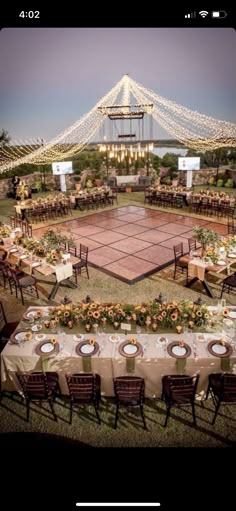 an outdoor tennis court is set up with tables and chairs for dinner guests to enjoy