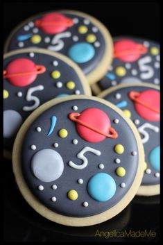 decorated cookies with space and planets on them