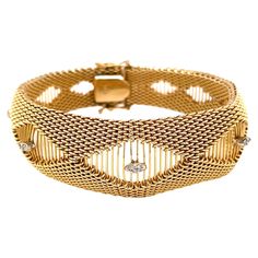 Stylishly sleek with a contoured shape, the patterned tightly woven fourteen karat 14K yellow gold mesh is accented with five unique marquise shaped stations each illuminated with twin diamonds. This stunning bracelet is 7-1/4 inches in length and is 3/4 inch at its widest center point. Flexible, it elegantly wraps the wrist and is finished with a a box clasp and double safety clips. Stamped 14K . Gift boxed. Thigh Jewelry, Latina Jewelry, Retro Bracelet, Bold Necklace, Dope Jewelry, Box Clasp, Statement Bracelet, Statement Jewelry, Timeless Elegance