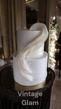 a large white cake sitting on top of a table