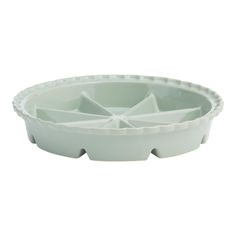 a white plastic bowl with four sections in it