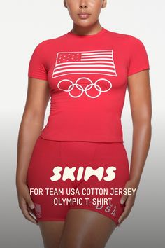 Our viral Cotton Jersey tee with a soft feel and stretchy, body-hugging fit. Detailed with a crew neck, short sleeves, and a length that hits below the natural waist. Features official graphics in support of the Team USA athletes participating in the Olympic Games Paris 2024. Fits true to size. | SKIMS Cotton Jersey Olympic T-Shirt | Red | 2XS | SKIMS For Team Usa Stretch T-shirt With Sublimation Print For Spring, Athleisure Stretch T-shirt With Letter Print, Fitted Letter Print T-shirt For Athleisure, Snug Fit Crew Neck T-shirt Athleisure, Snug Fit Crew Neck Athleisure T-shirt, Athleisure Snug Fit Crew Neck T-shirt, Stretch Crew Neck T-shirt With Text Print, Sporty Snug Fit Short Sleeve T-shirt, Fitted Sports T-shirt With Sublimation Print