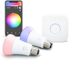 the smart light bulbs are next to an iphone