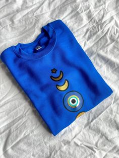 Designed by Amida by Zaa© Crew Neck Blue Sweater With Graphic Print For Loungewear, Blue Graphic Print Sweater For Loungewear, Moon Phases, Evil Eye, Best Sellers, Sweat Shirt, Royal Blue, Navy Blue, Moon