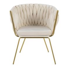 an upholstered chair with gold legs and a white cushion on the backrest