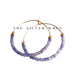 Tanzanite Gold Hoop Earrings D E T A I L S These gorgeous hoop earrings are created with Genuine Natural Tanzanite 3mm beads and 14kt gold filled accents   Beaded by hand  14kt gold filled 35mm hoops  ∙ EXTRA LOVE ∙ Crafted and curated just for you in the desert of our Arizona studio. All of our jewelry comes gift packaged!  We are happy to leave a note if this is a special gift, just let us know in the message box at checkout.  PRODUCTION ∙ TIMES All items are made to order. Please check the top of our policies page for the most current production time before shipping. If you need it sooner, select a faster shipping at checkout.  ∙ What is gold filled? ∙ Gold filled jewelry is beautiful long lasting material, it is very durable and will not chip or turn colors. With proper care it can las Faceted Hoop Jewelry For Gifts, Faceted Hoop Earrings As Gift, Jewelry Hoop Earrings, Earrings Gold Hoop, Tanzanite Jewelry, Tanzanite Earrings, Gift Best Friend, Crystal Jewellery, Hoop Earrings Gold