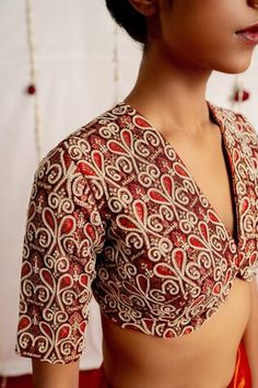 Red and ivory blouse with all over brocade pattern, accentuated with beads, cutdana embroidery. - Aza Fashions Elegant V-neck Choli With Resham Embroidery, Elegant Embroidered V-neck Blouse Piece, Elegant Fitted Embroidered Fabric For Diwali, Festive V-neck Blouse With Resham Embroidery, Fitted Embroidered Fabric With Motifs For Reception, V-neck Wedding Blouse With Intricate Embroidery, Festive V-neck Embroidered Top For Wedding, Elegant Party Embroidered Unstitched Blouse Fabric, Elegant Silk Choli With Motifs