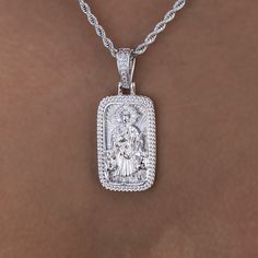 Introducing the Icon Shepherd Pendant, a statement piece in 14k White Gold. This piece features intricately designed imagery of the Shepherd with an iced out halo, a Cuban link border and finished with an iced out bail. This standout piece is a must have and pairs perfectly with our 4mm Rope Necklace. This product is guaranteed for life - GLD will repair the item should you experience any defects in craftsmanship or breakage. Specifications - 18mm x 30mm (Width x Height) - Weight: (Weight can va White Iced Out Sterling Silver Jewelry, Iced Out White Sterling Silver Jewelry, White Engraved Cubic Zirconia Jewelry, White Iced Out Fine Jewelry, Iced Out White Fine Jewelry, White Diamond Jewelry With Iced Detail, White Diamond Iced Jewelry, White Iced Diamond Jewelry, White Diamond Jewelry With Rectangular Pendant