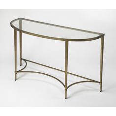 a glass and metal console table with an oval shaped design on the top, against a white background