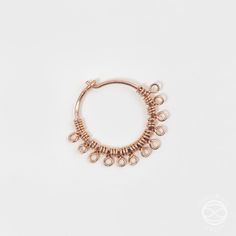 an image of a gold hoop earrings on a white background