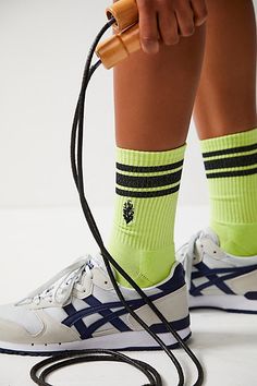 Always be seen in these neon striped crew socks from FP Movement, featuring reflective details to catch all the light. **Fit:** Crew length **Features:** Stretchy cotton fabrication, seamed toe and heel, sporty stripe details, buti logo, reflective details **Why We | Flash Stripe Logo Tube Socks by FP Movement at Free People, Lime/Black Yellow Sporty Socks For Sports, Sporty Green Socks For Streetwear, Neon Stripes, Tube Socks, Fp Movement, Boho Clothing, Crew Socks, Boho Outfits, Flash