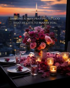 a table with candles and flowers on it in front of a cityscape that says imagine a man praying to god that he gets to marry you