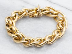 This bold gold chain bracelet is of the highest possible quality. The craftsmanship is exquisite, with polished round spacers creating a sleek contrast to the textured rings that form the basis of the bracelet. This is weighty and luxurious on the wrist and gives an aura of obviously good quality without being ostentatious. Metal: 18K Yellow GoldWidth of Chain: 13.4 mmLength of Chain: 7 1/2 InchesMarks: "ITALY" Stamped on the clasp Gold Chain Bracelet, Gold Link Chain, Textured Ring, Gold Bracelet Chain, Chain Bracelet, Gold Chain, Gold Chains, Good Quality, Aura